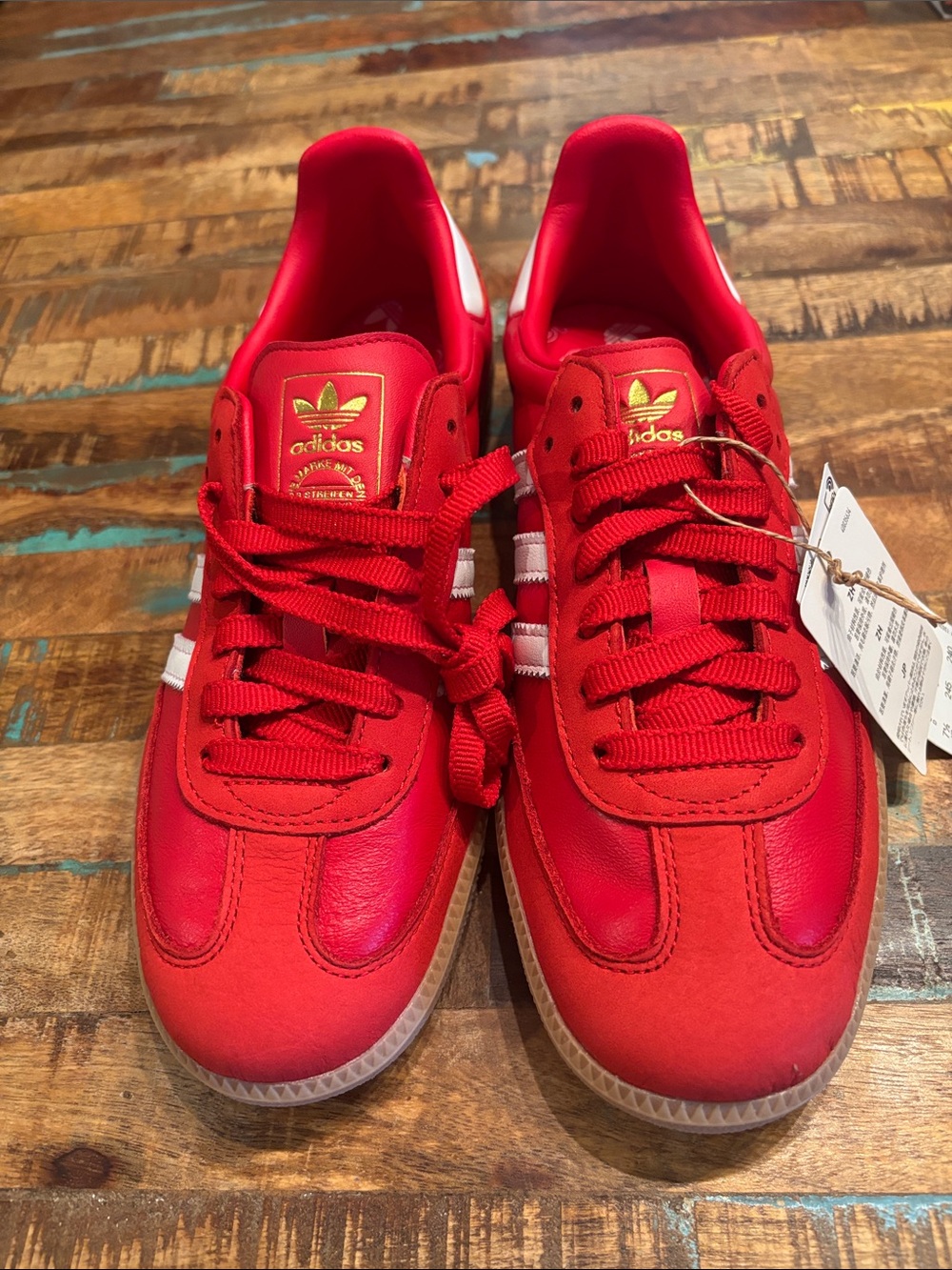 adidas Women's Red Sneakers with White Stripes